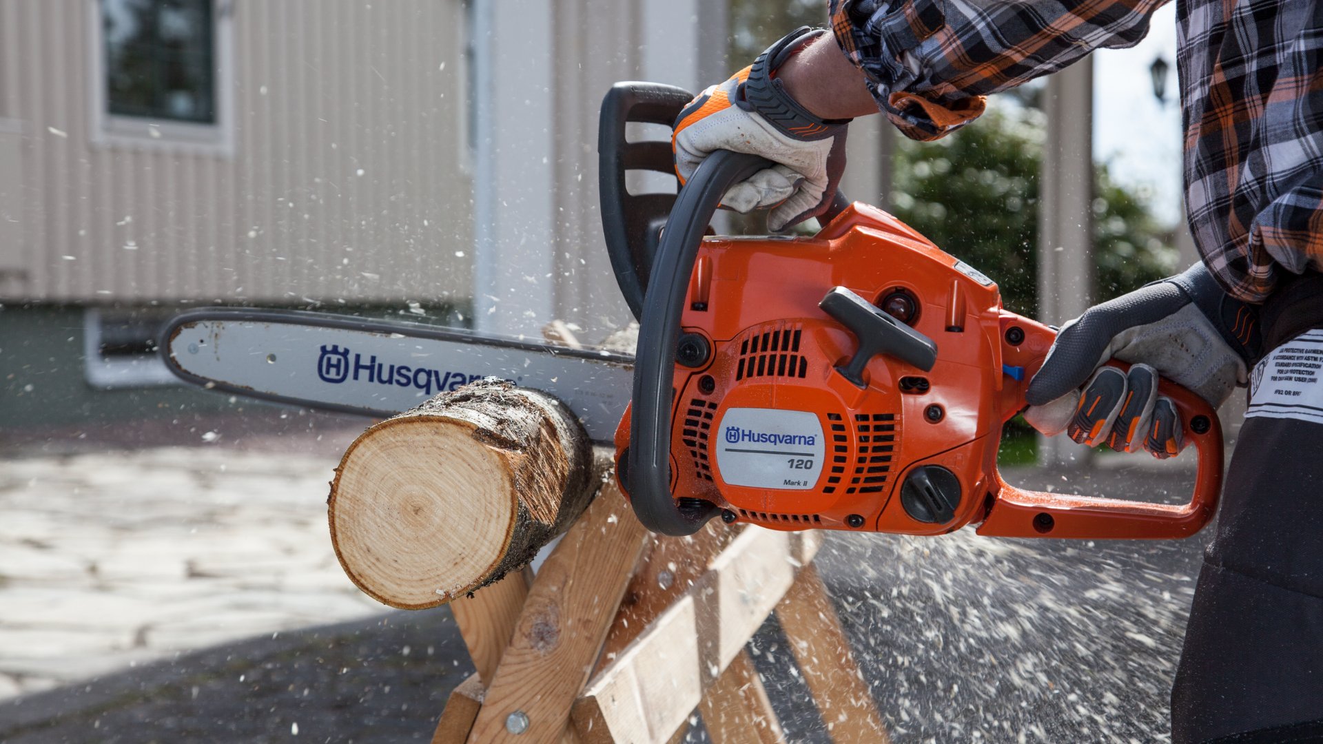 sawing through wood with chainsaw